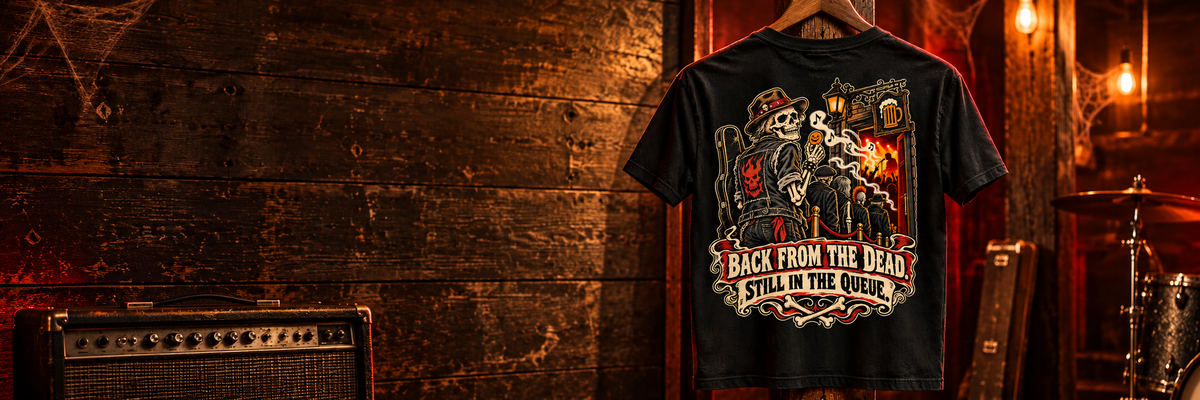 Halloween: Dead Loud black back-print tee hanging in an amber-lit pub band room