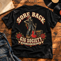 Sore Back Gig Society Heavyweight Tee — Black back print in vintage vinyl flat-lay setting