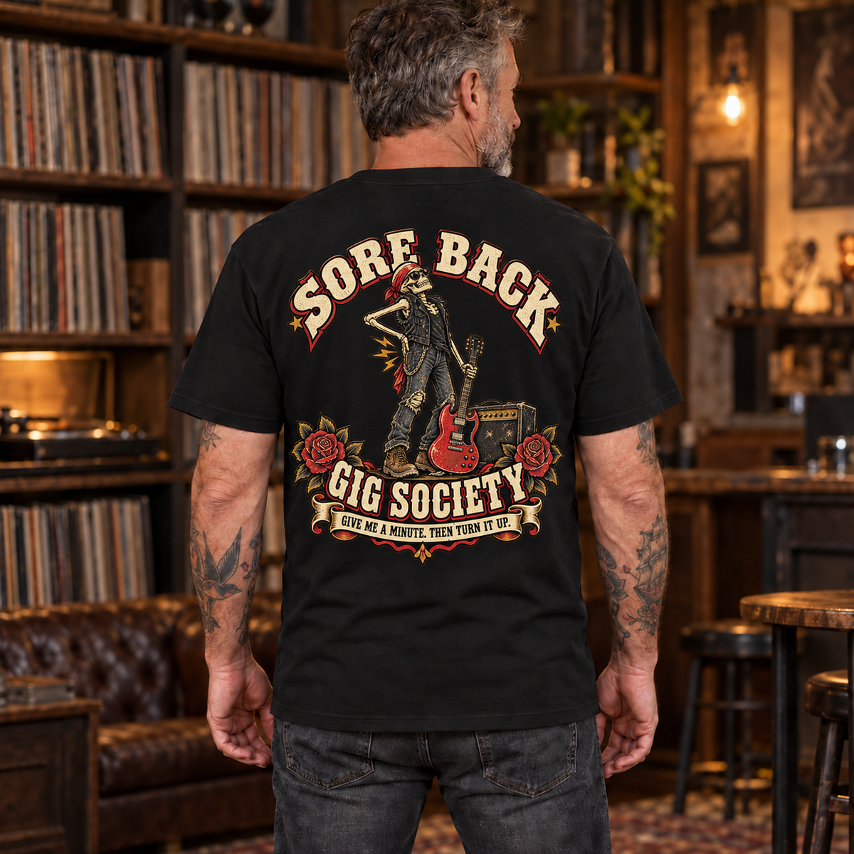Sore Back Gig Society Heavyweight Tee — mature model wearing Black back print