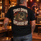 Tools Down Speakers Up Heavyweight Tee — Black pub lifestyle back view
