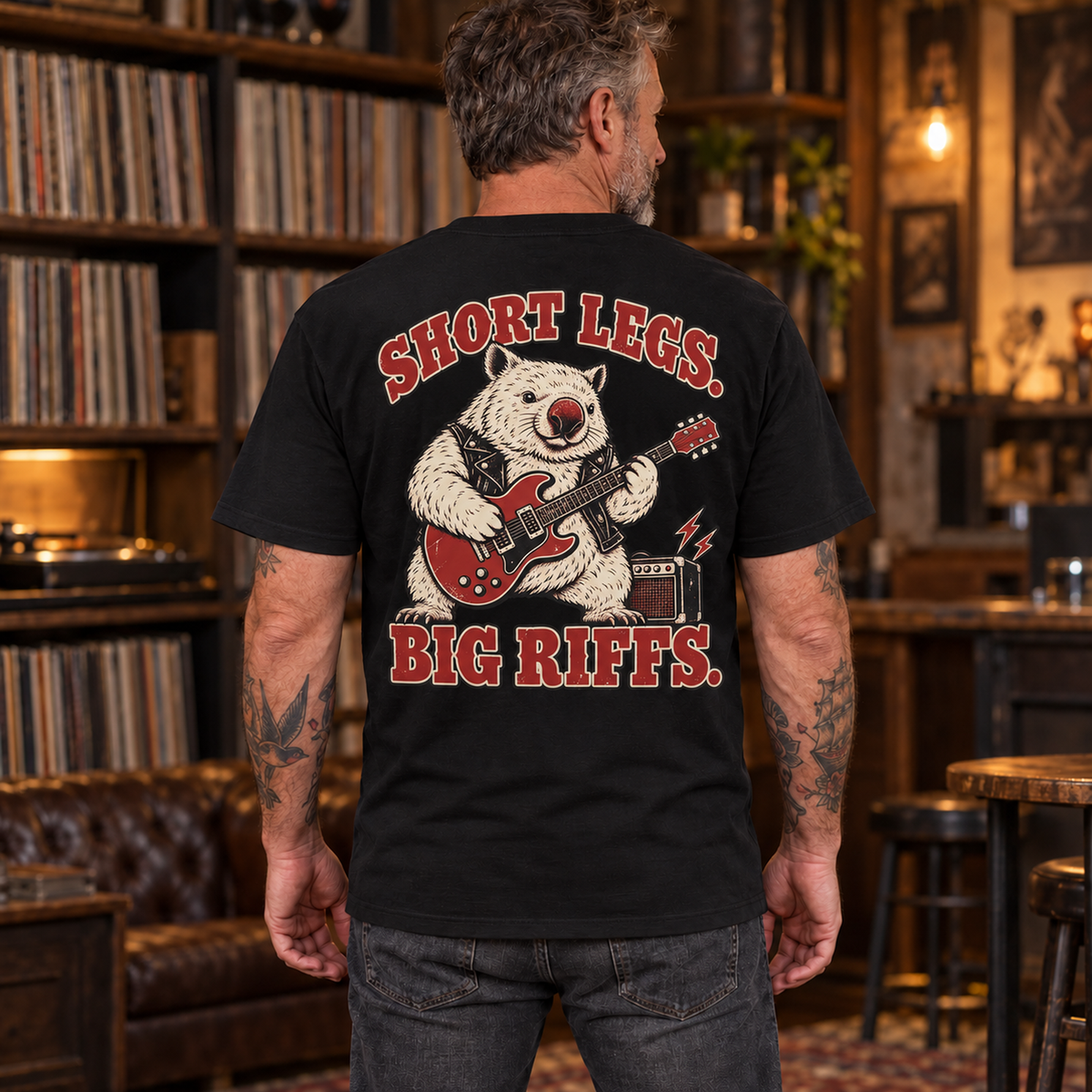 Man wearing Short Legs Big Riffs Wombat heavyweight tee with back print