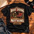 Busy Doing Nothing Loudly Heavyweight Tee — Black back print flat-lay hero