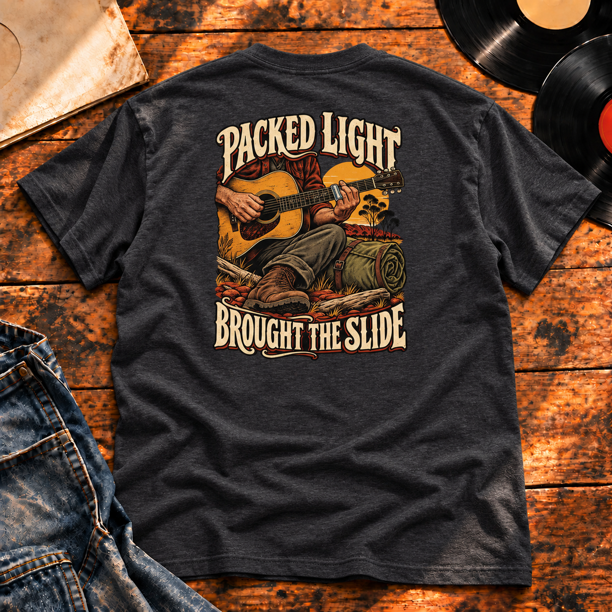 Packed Light Brought the Slide Heavyweight Tee — charcoal back-print hero