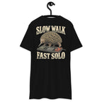 Slow Walk Fast Solo Heavyweight Tee — Black, back view on hanger (Printful)