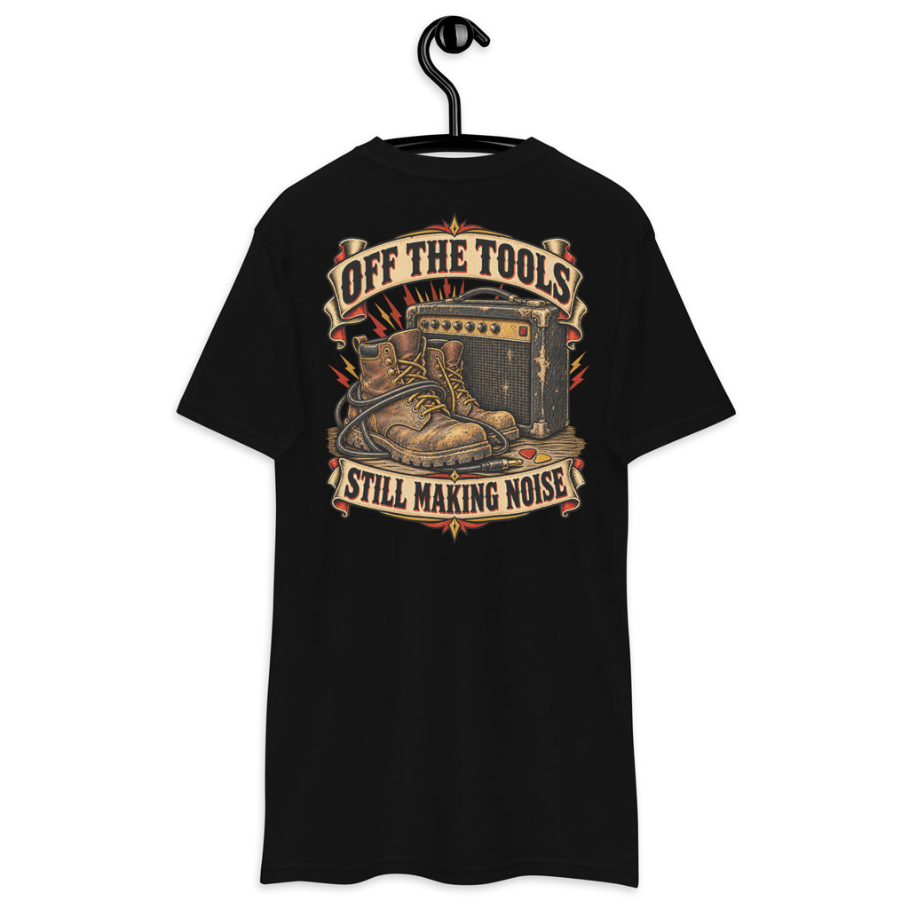 Off The Tools Still Making Noise Heavyweight Tee — Black, back view on hanger (Printful)