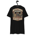 Never Famous Always Loud Heavyweight Tee — Black, back view on hanger (Printful)