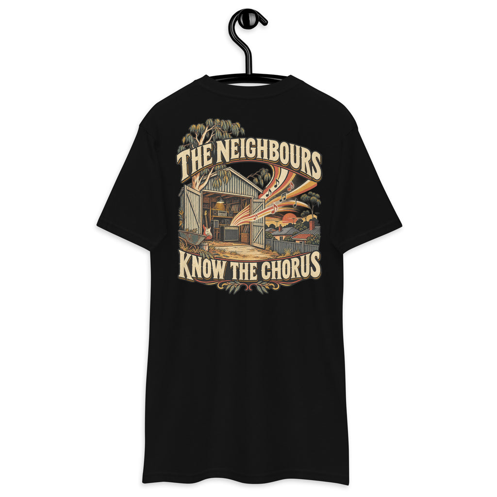 The Neighbours Know The Chorus Heavyweight Tee — Black, back view on hanger (Printful)