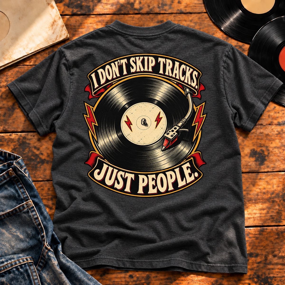 I Don’t Skip Tracks Charcoal Heather heavyweight tee — back print flat-lay hero