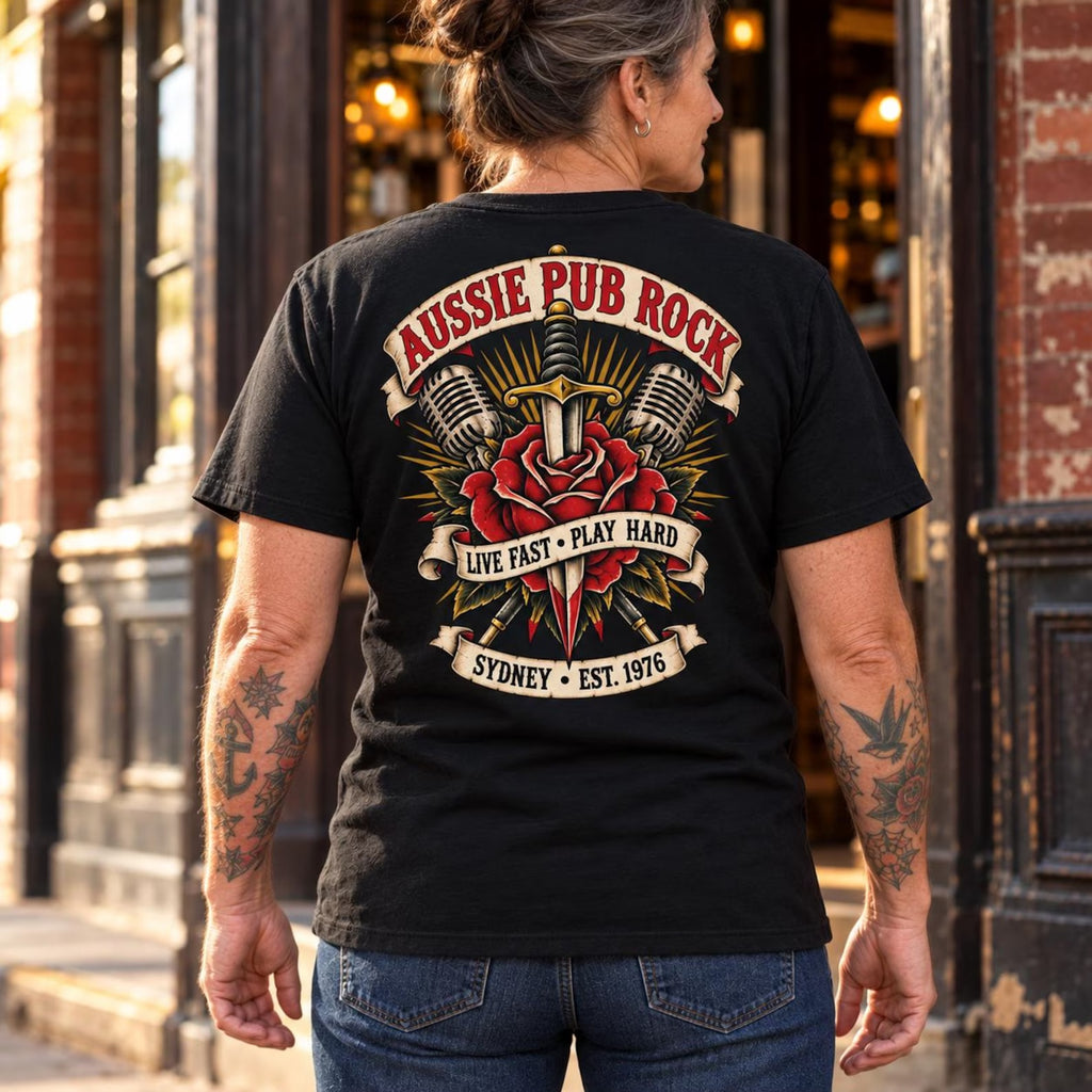 Woman wearing the black Australian Pub Rock T-shirt, showing the rose and dagger back print