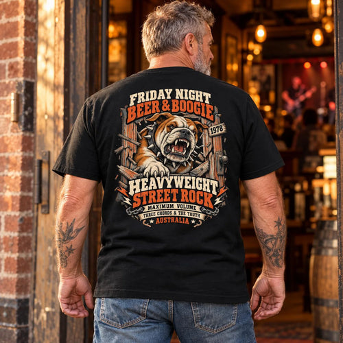 Man wearing the black Beer and Boogie Bulldog T-shirt, showing the back print outside a pub