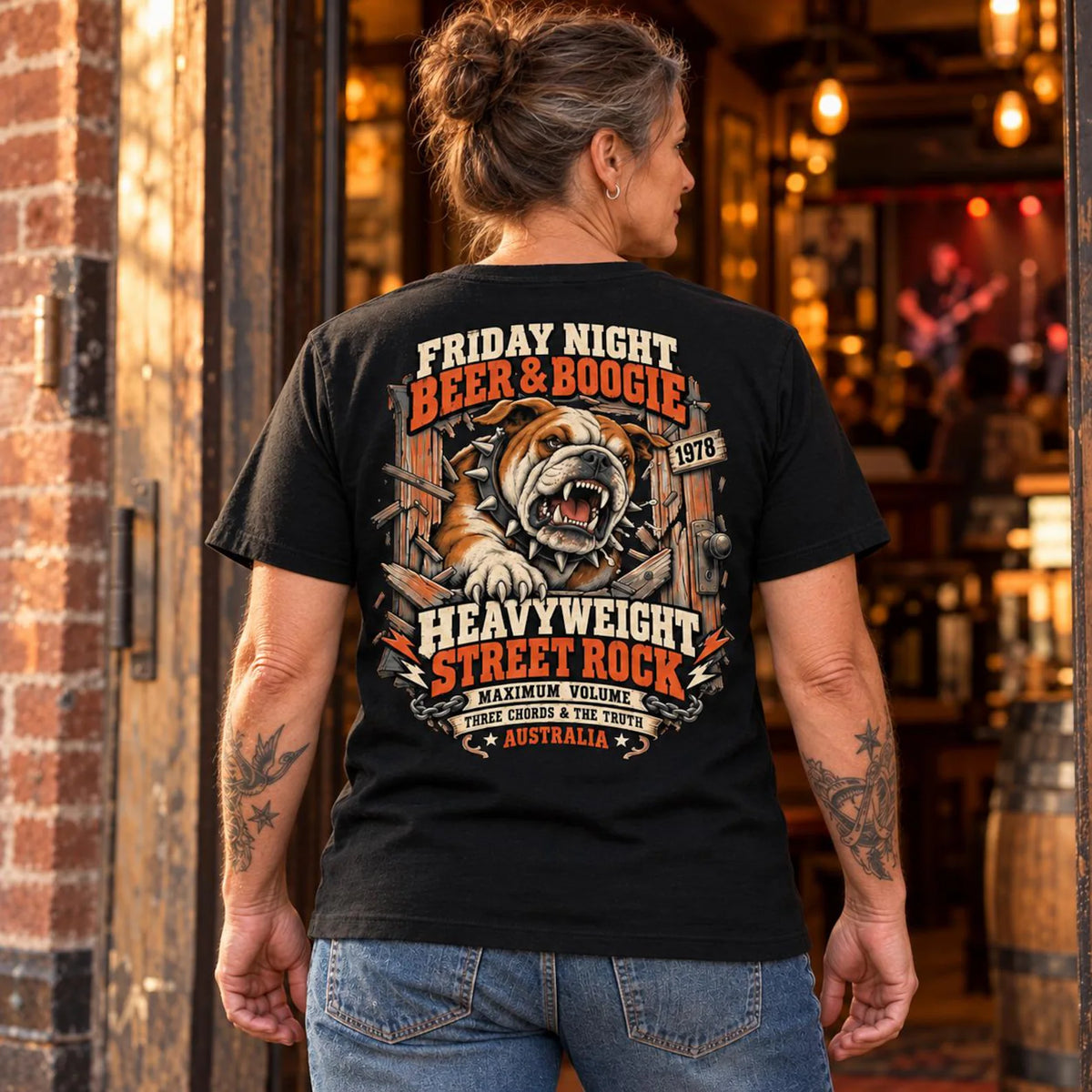 Woman wearing the black Beer and Boogie Bulldog T-shirt with the back print visible