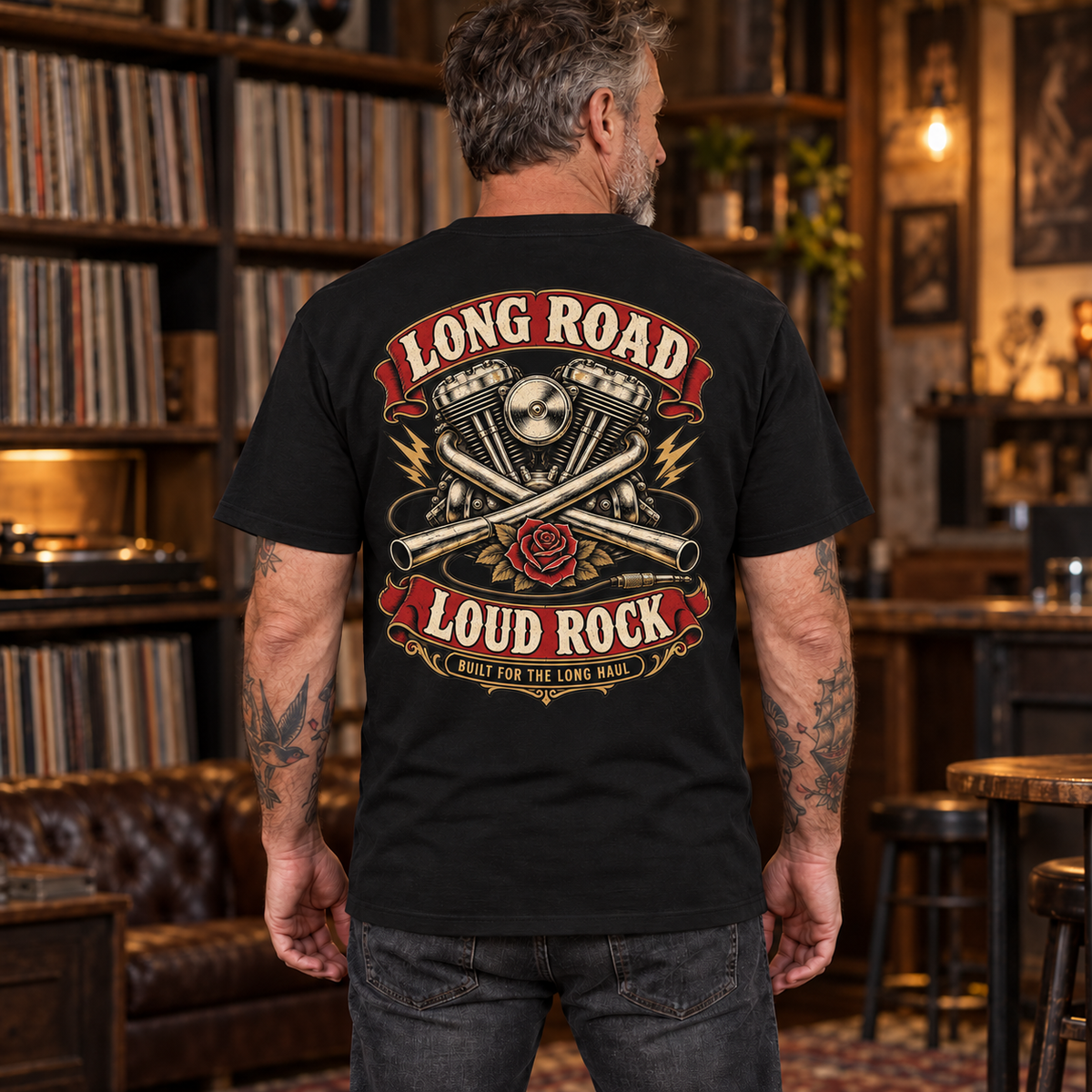 Long Road Loud Rock Heavyweight Tee — mature model wearing the black back-print tee