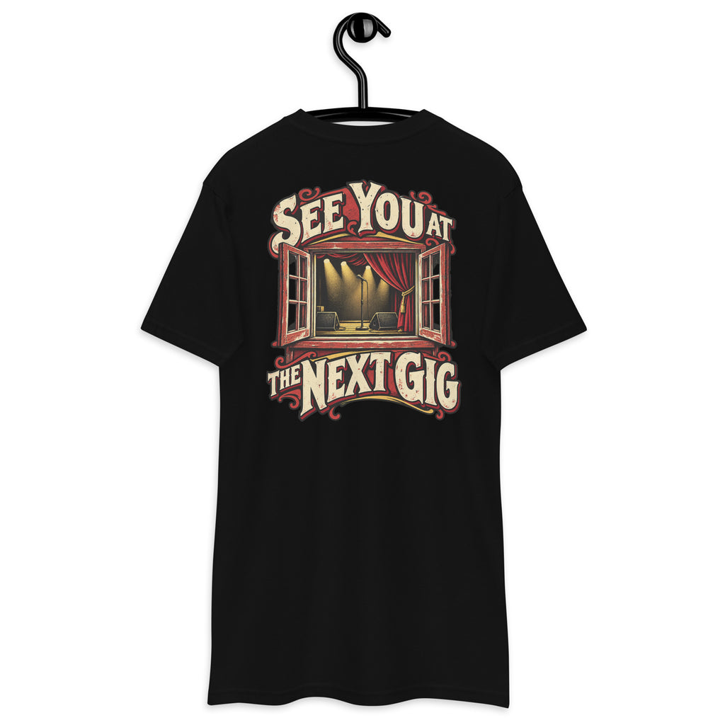 See You at the Next Gig Heavyweight Tee — Black, back view on hanger (Printful)