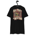 See You at the Next Gig Heavyweight Tee — Black, back view on hanger (Printful)