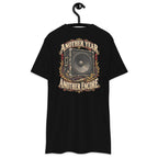 Another Year Another Encore Speaker Edition Heavyweight Tee — Black, back view on hanger (Printful)