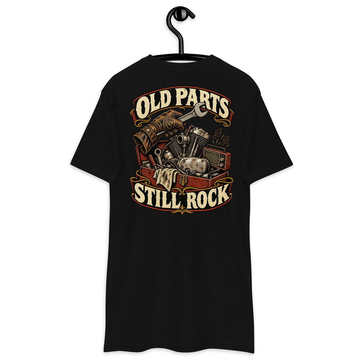 Old Parts Still Rock Heavyweight Tee — Black, back view on hanger (Printful)
