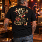 Tattooed pub-rock fan wearing Old Ink, New Noise back print tee
