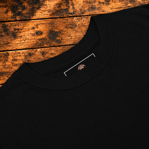 black tee collar and Outlaw neck label on rustic wood