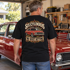Six Cylinders, No Quiet Setting Heavyweight Tee — black back print worn in a classic-car setting